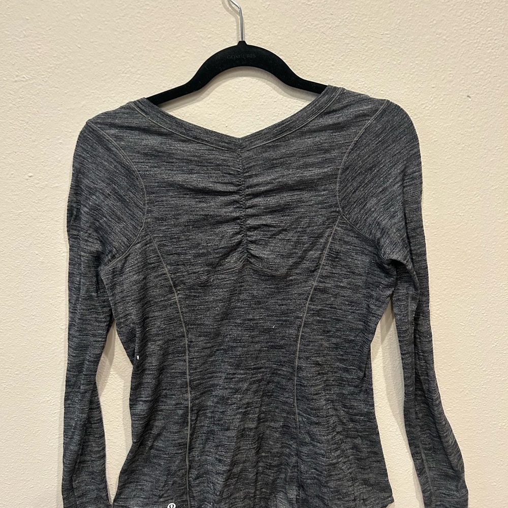 Lululemon top. Fitted and shaped. Size medium. Dark gray. New $50.